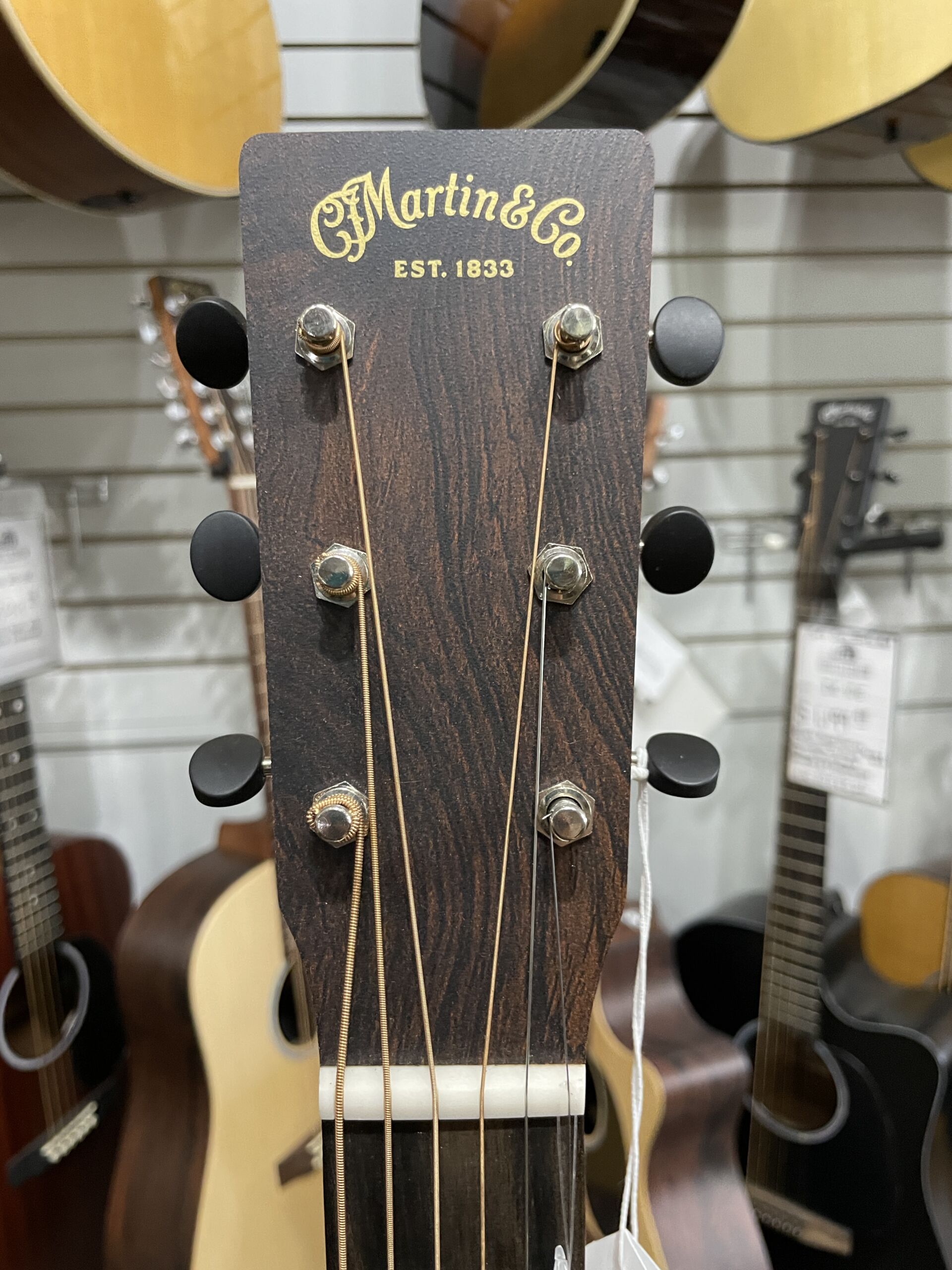 Martin Road Series D-10E Retro 2026 - AgMartin Road Series D-10E Retro – Aging Toner SOFTCASE INCLUDED The Martin D-10E Retro captures the essence of a classic Martin dreadnought while incorporating modern features designed for today's musicians. Built with a solid Sitka spruce top and solid sapele back and sides, it produces strong projection, warm mids, crisp highs, and excellent note definition. The vintage-inspired Aging Toner finish gives the guitar the appearance of a well-loved instrument right out of the case, while the satin finish enhances resonance and provides a comfortable playing feel. Martin's scalloped bracing allows the top to move freely, resulting in impressive volume and responsiveness. Equipped with Martin E-1 electronics and an onboard tuner, the D-10E Retro is ready for live performance, recording sessions, or worship settings. The Performing Artist neck profile and High-Performance Taper make it comfortable for both rhythm and lead playing. Whether you're a singer-songwriter, bluegrass picker, worship leader, or weekend performer, the D-10E Retro offers authentic Martin craftsmanship and tone at a price that's hard to beat. Specifications Body Size: Dreadnought (D-14 Fret) Top: Solid Sitka Spruce Back & Sides: Solid Sapele Bracing: Scalloped X-Bracing Neck: Select Hardwood Neck Profile: Performing Artist Profile Neck Taper: High-Performance Taper Scale Length: 25.4" Fingerboard: FSC Certified Richlite Bridge: FSC Certified Richlite Nut Width: 1-3/4" (44.5mm) Nut Material: White Corian Saddle: Compensated White Tusq Electronics: Martin E-1 Electronics with Built-In Tuner Finish: Satin Aging Toner Top / Satin Body Tuners: Chrome Enclosed Gear Case: Martin Softshell Gig Bag Made In: Nazareth, Pennsylvania, USAing Toner - Image 5